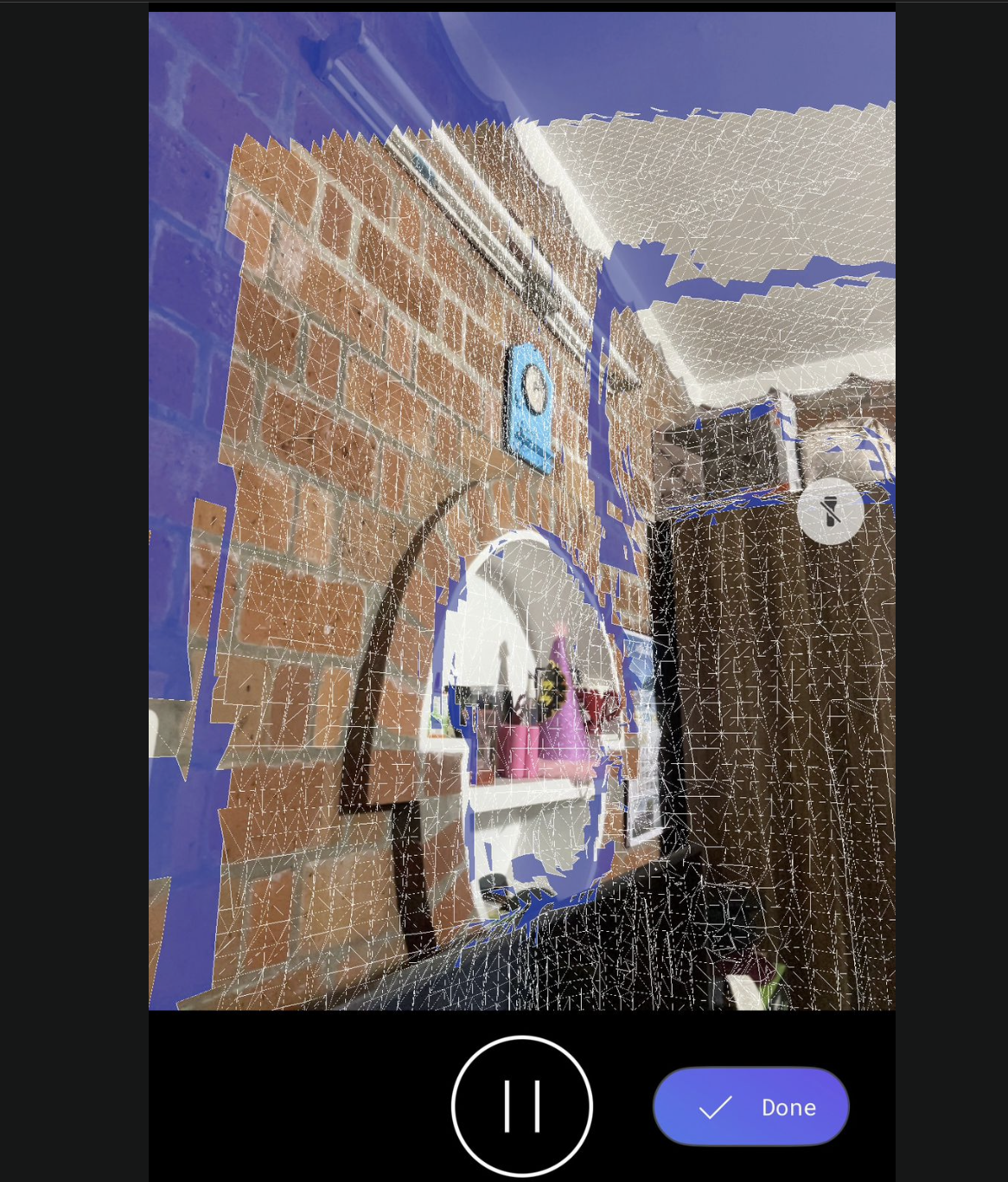 Another mid-scan view — wireframe overlaid on a brick wall with a round mirror